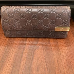 Gucci wallet.  Approximately 8x4